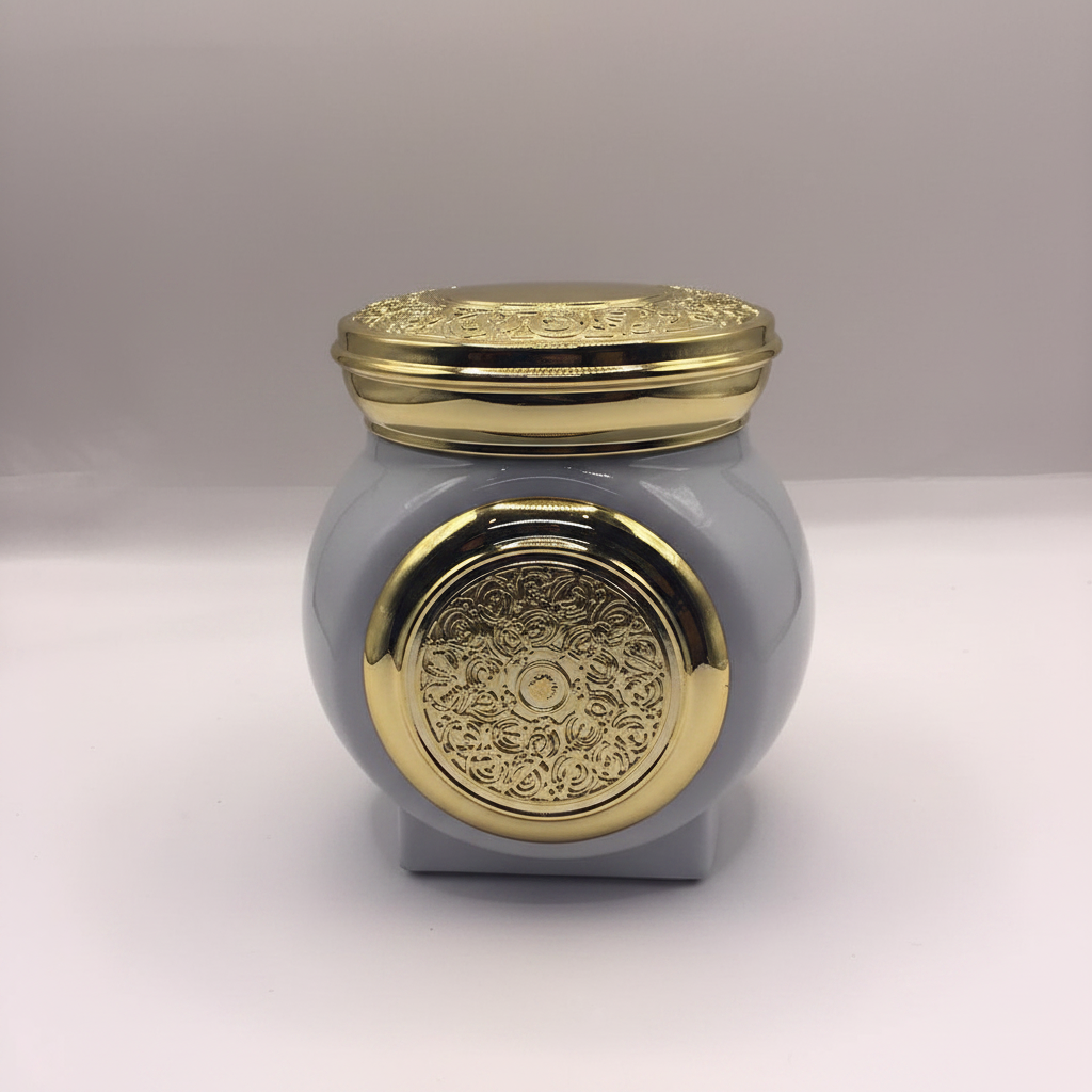 Grey ceramic Bakhoor jar with gold arabesque lid – front studio shot