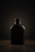 Matte black glass bottle dark moody lifestyle shot