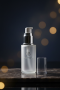 Frosted glass pump bottle dark elegant lifestyle shot