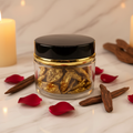 Clear glass Bakhoor jar lifestyle shot on marble with oud and candlelight
