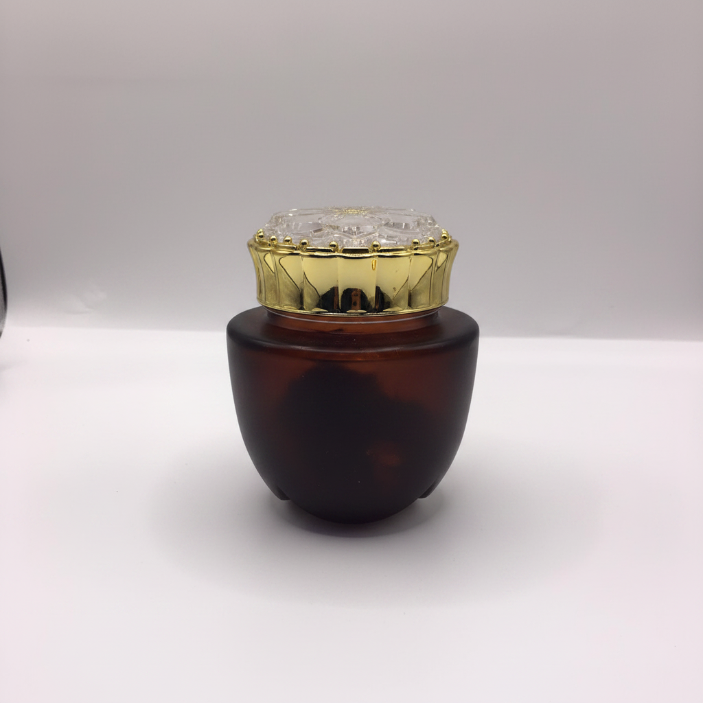 Amber frosted bakhoor jar studio white background