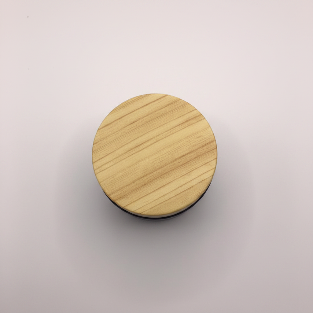 Matte black Bakhoor jar – overhead top-down view of wood grain lid